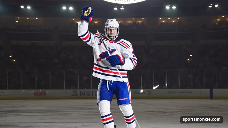 NHL rookie skating up the ice during a game under arena lights