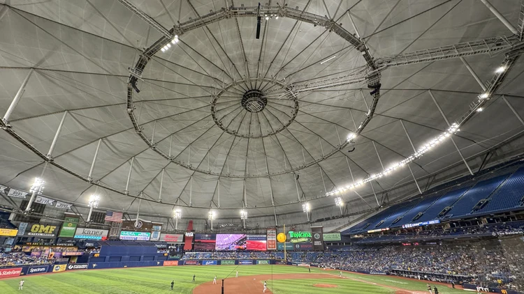 File photo from 10 June 2024: the interior of Tropicana Field in St. Petersburg, with its domed roof, the field and a crowd. It was not taken at World Series Game 3.