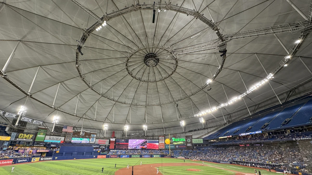 File photo from 10 June 2024: the interior of Tropicana Field in St. Petersburg, with its domed roof, the field and a crowd. It was not taken at World Series Game 3.