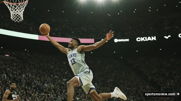 A young basketball player warming up on an NBA court before tipoff