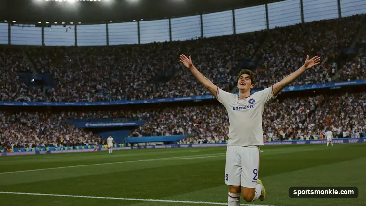 Young footballer celebrating with the World Cup trophy raised overhead
