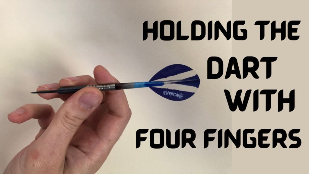 Holding the dart with four fingers