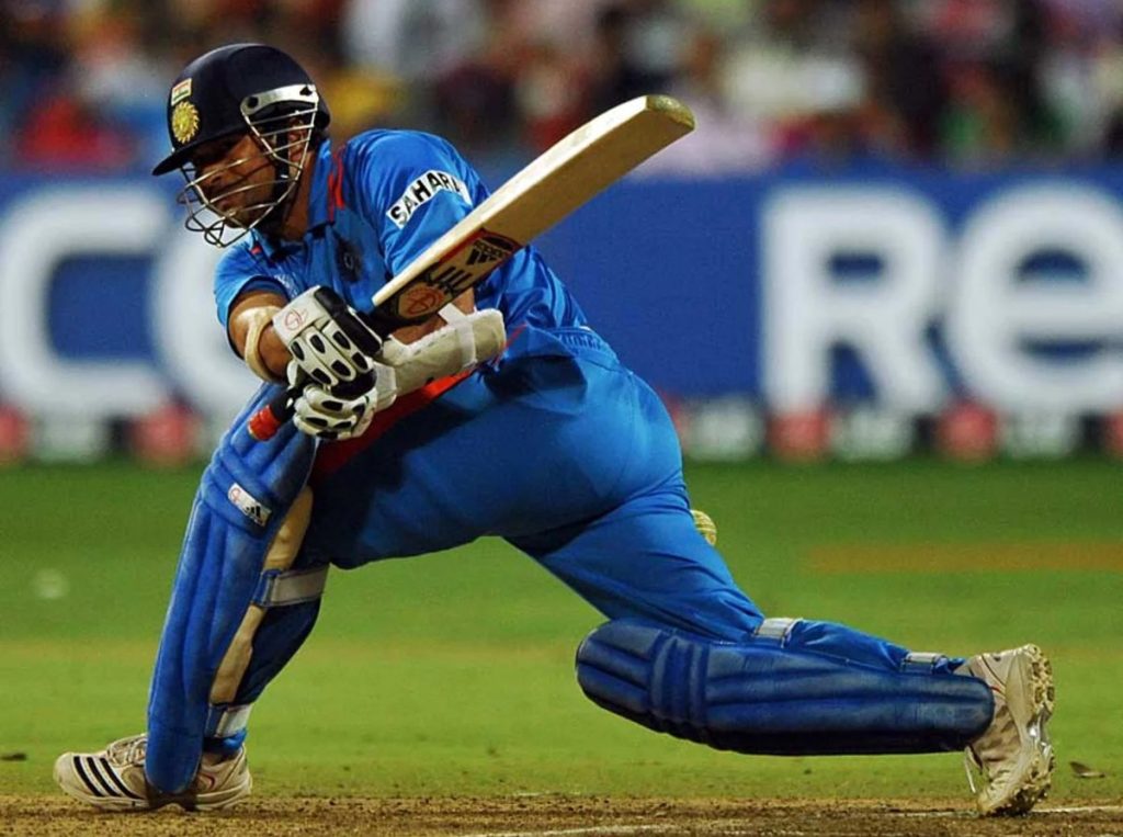 Indian batsman Sachin Tendulkar playing a paddle sweep.