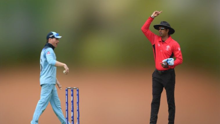 An umpire giving signal to a player of Free hit.