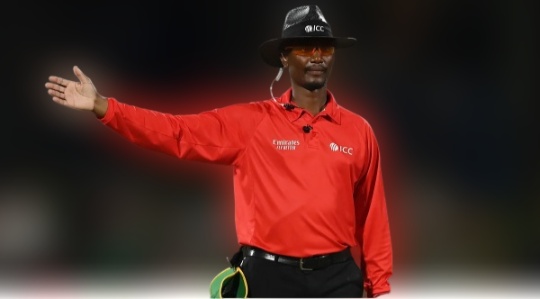 an umpire showing sign of no ball